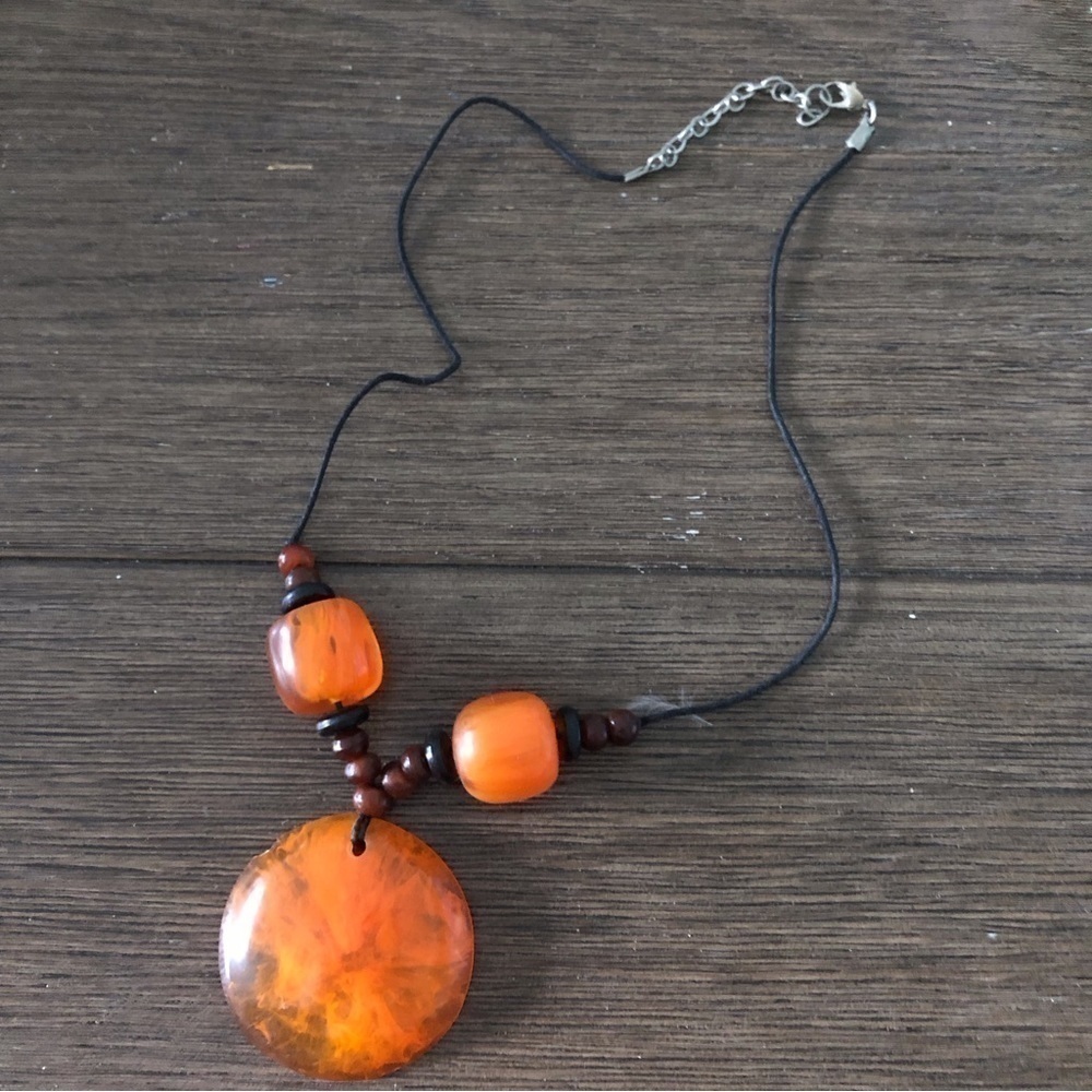 Large orange glass pendent on cord necklace